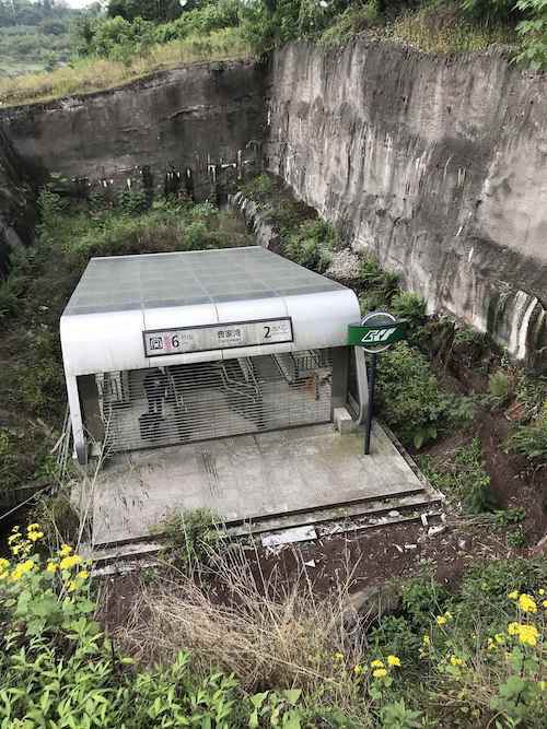 Caojiawan metro station's entrance surrounded by rocks