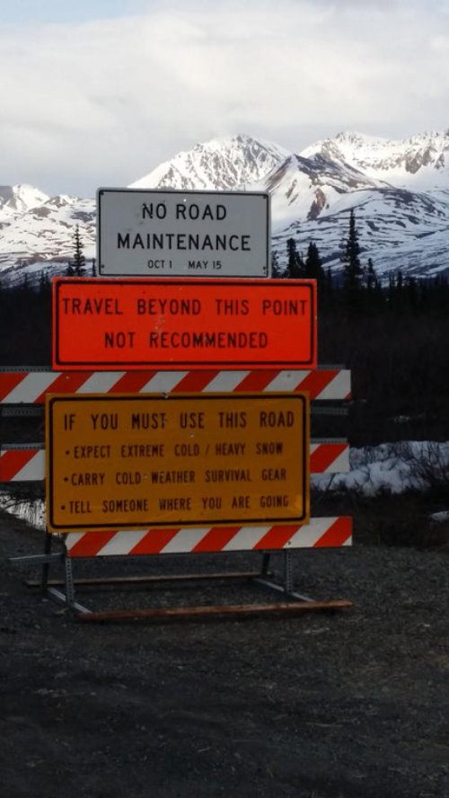 A sign stating that "Travel Beyond This Point [is] Not Reccommended"